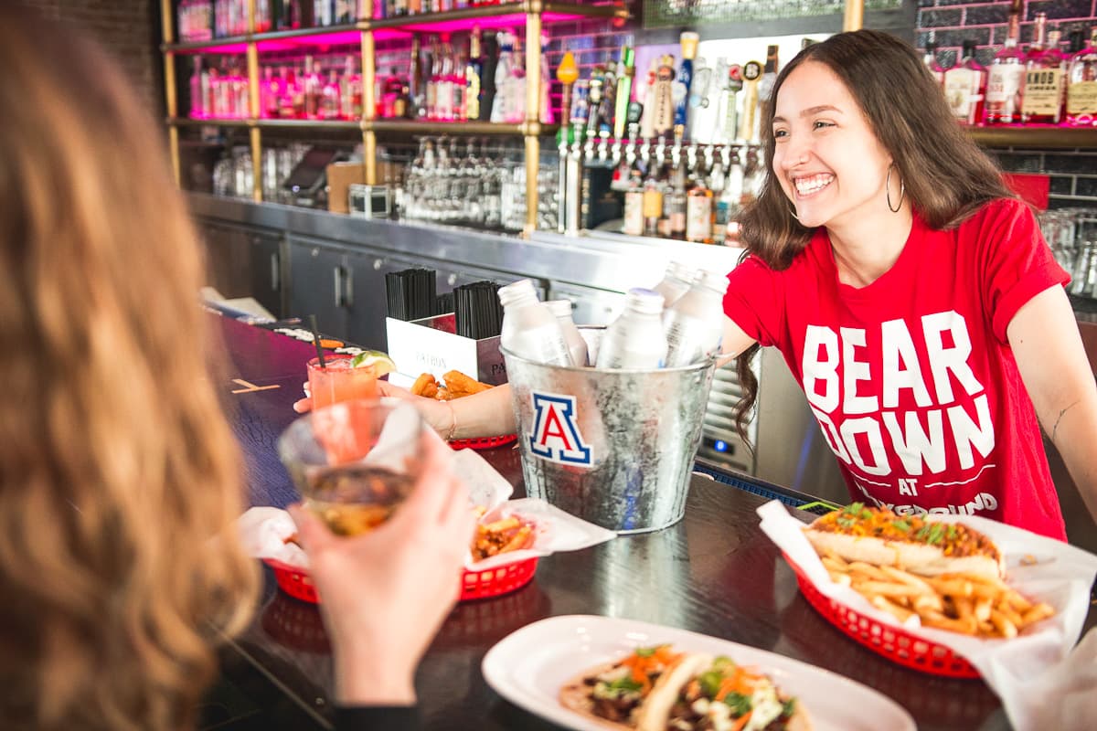 “Bear Down at Playground”: Catch the next UA away game at official watch party hot spot