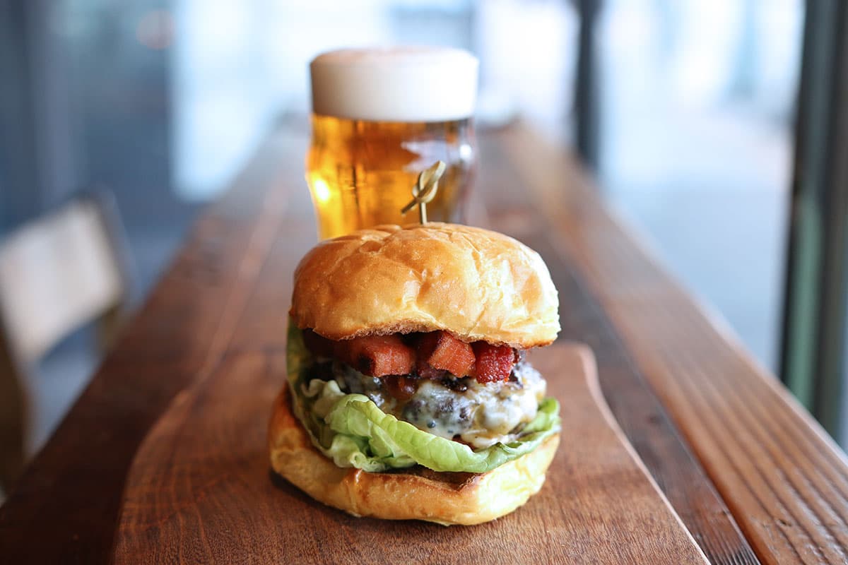Zip Burger with New Belgium Shift at Ermanos (Credit: Adam Lehrman)
