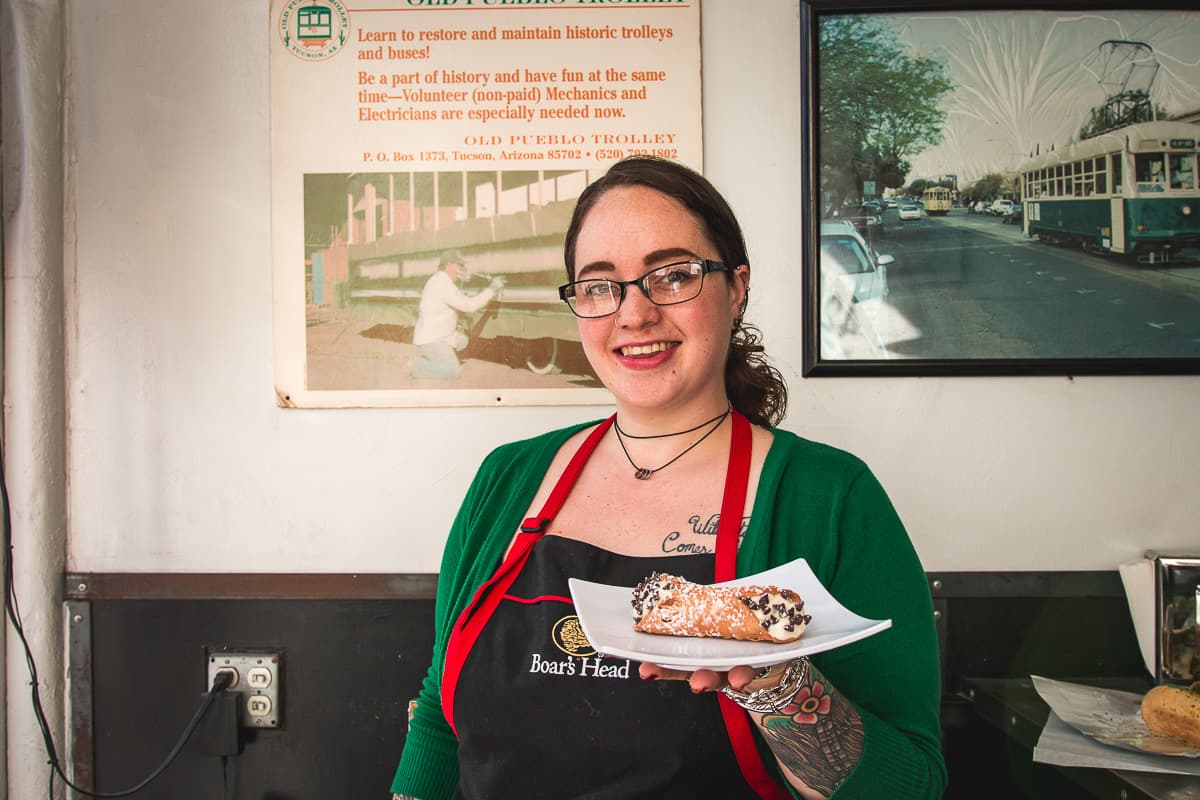 Kylie Myers with cannoli at 4th Avenue Delicatessen (Credit: Jackie Tran)