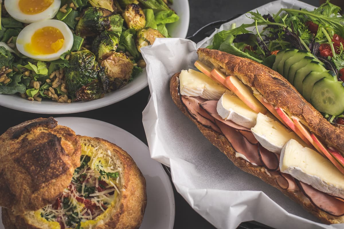 Breakfast Salad, Brie Baguettine, and Breakfast Boule at aka Deli & Bakeshop (Credit: Jackie Tran)