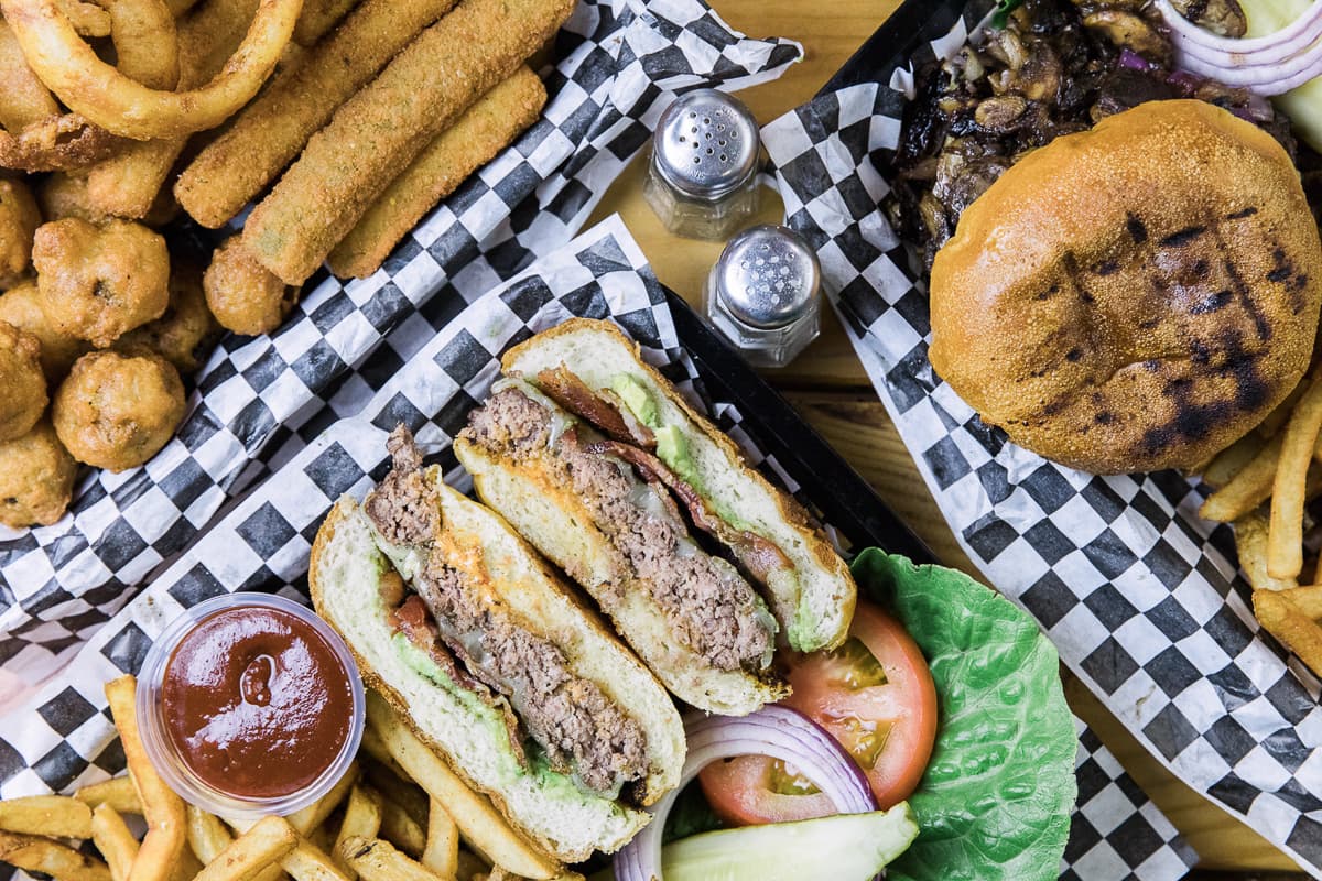 Amigo Burger and Steak Burger at Amigos Burgers and Beer (Credit: Taylor Noel Photography)