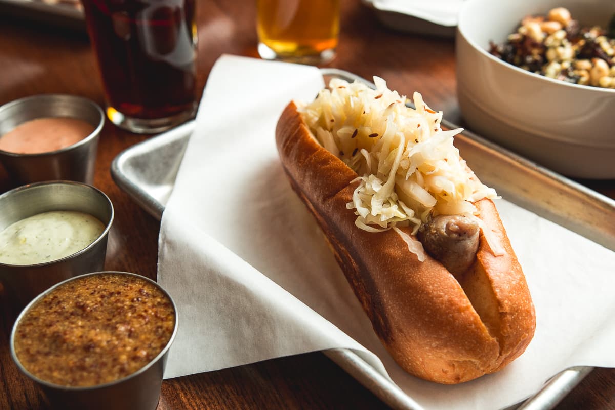 Bratwurst with Sauerkraut at Ten55 Brewing and Sausage House (Credit: Jackie Tran)