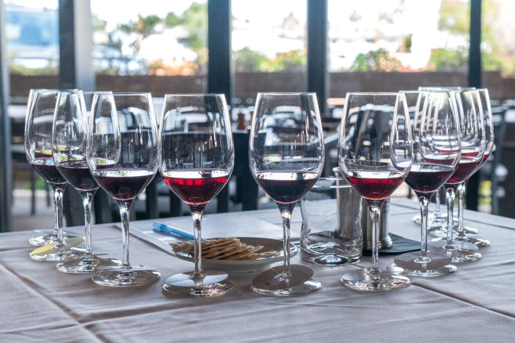 a table topped with glasses of wine