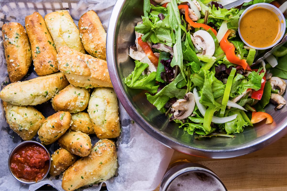 Superstix and Vegi Salad at Fresco Pizzeria & Pastaria (Credit: Taylor Noel Photography)