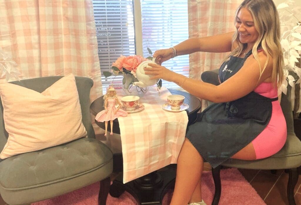 a woman sitting on a table