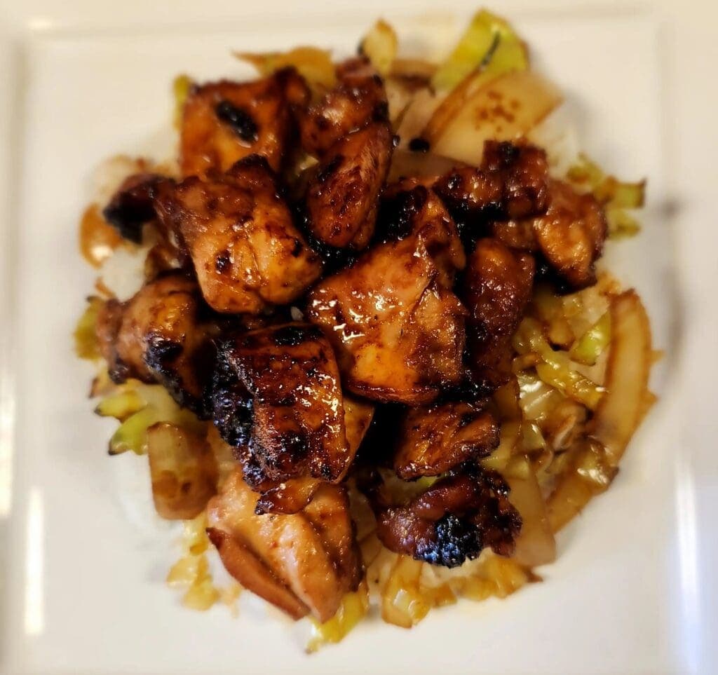 a plate of food with meat and vegetables