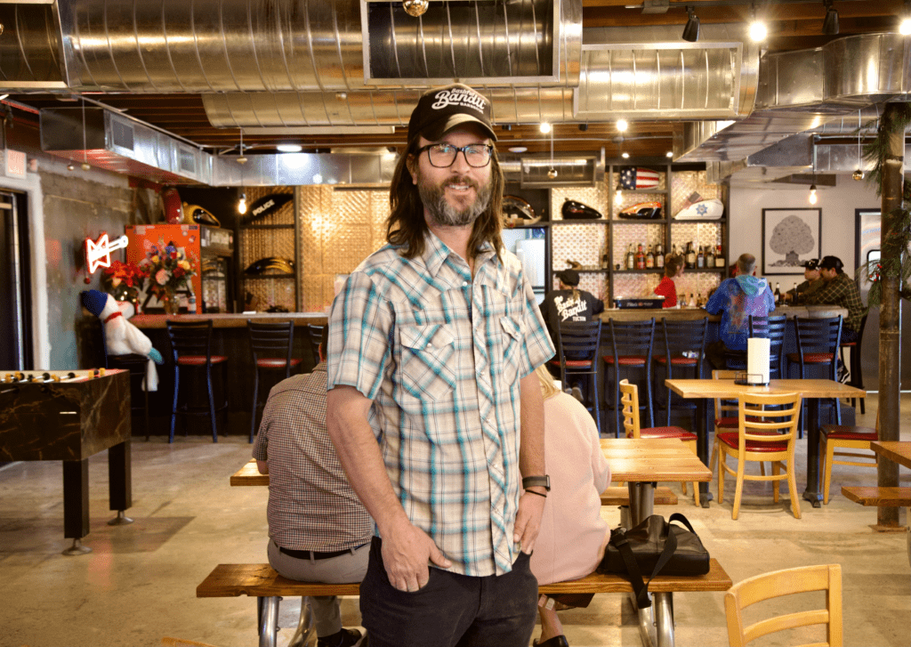 a person standing in front of a restaurant