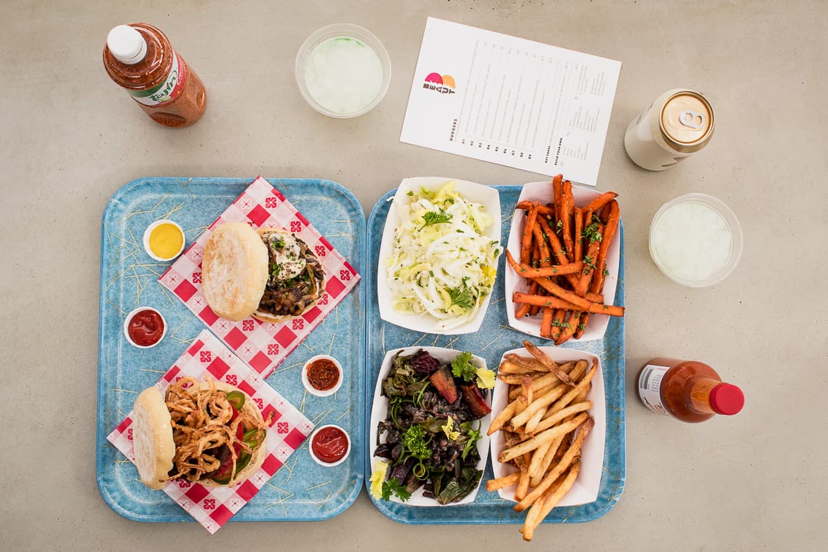 B8 and B4 burgers, coleslaw, fresh herb sweet potato fries, veggies, and regular fries at Beaut Burger (Credit: Jackie Tran)
