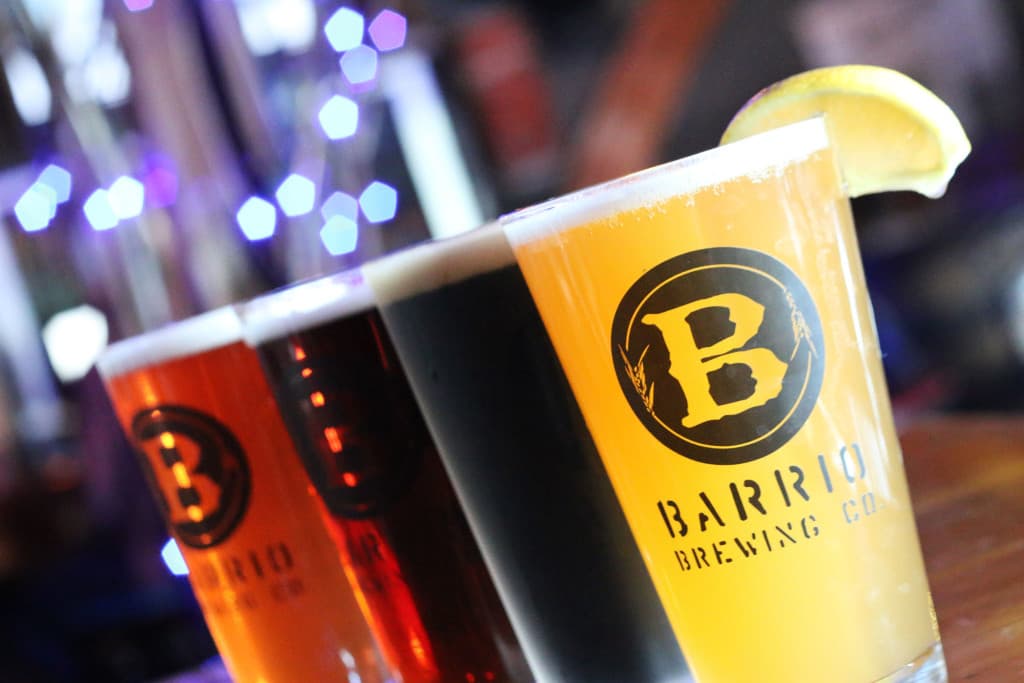 Barrio Brewing Company lineup of Hola Hefeweizen, Nolan's Porter, Barrio Rojo, and Raspberry Ale (Credit: Adam Lehrman)