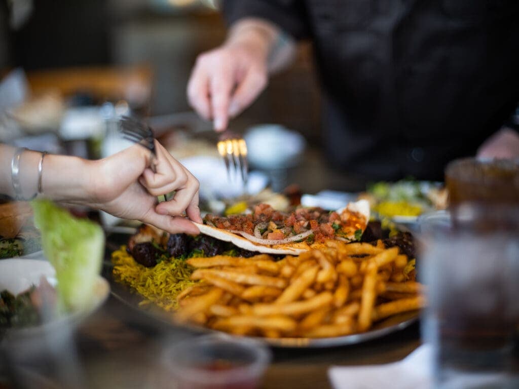 a person cutting food on a table