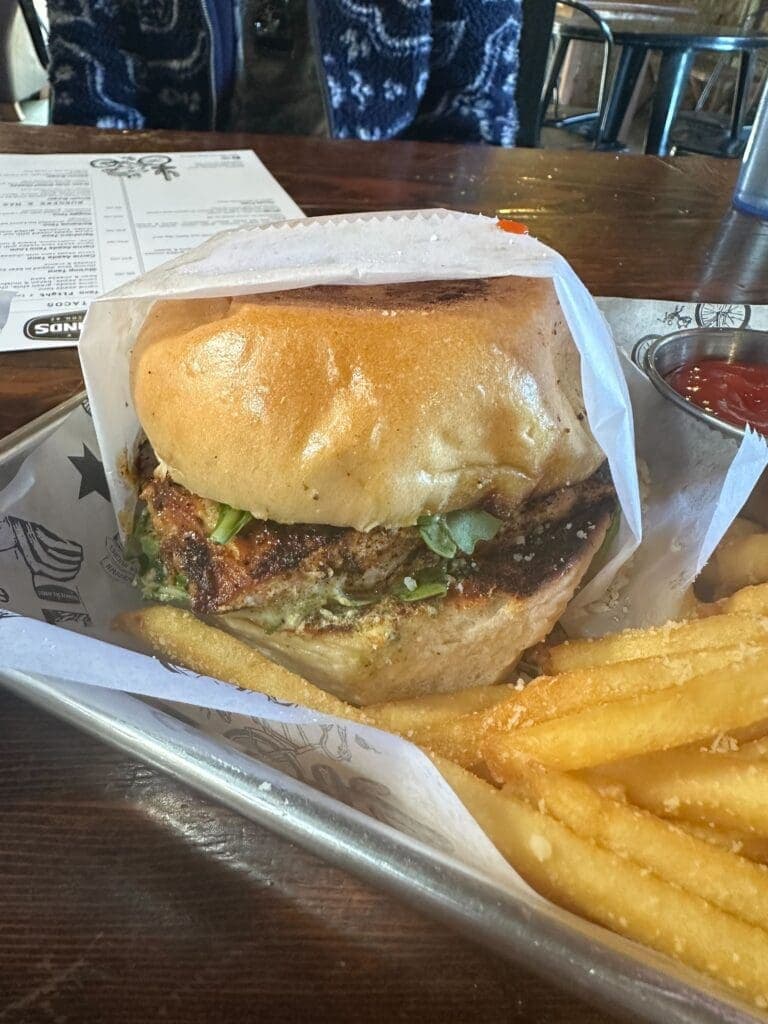 a sandwich sitting on top of a paper plate