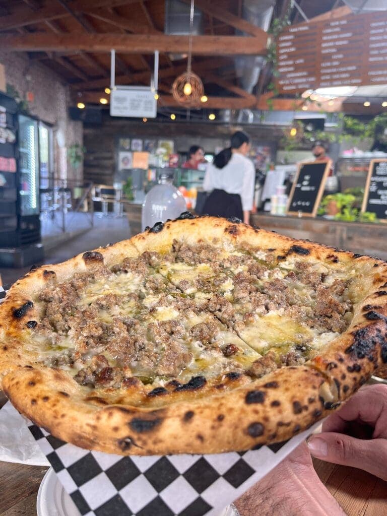 a slice of pizza sitting on top of a table