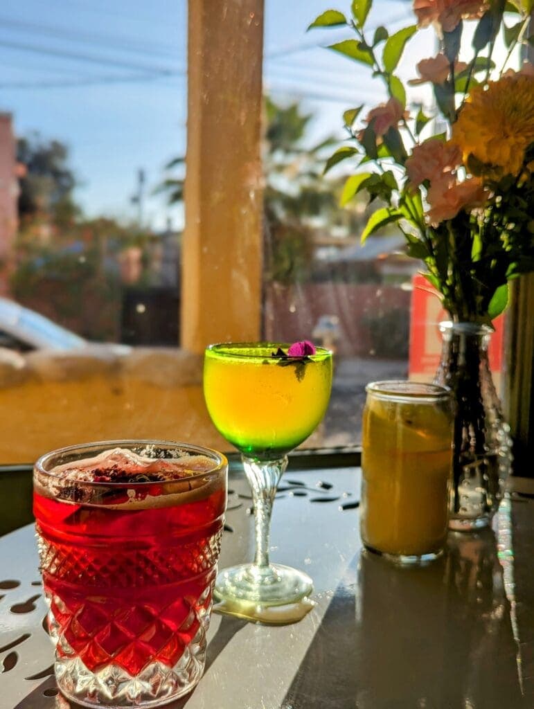 a glass of orange juice on a table