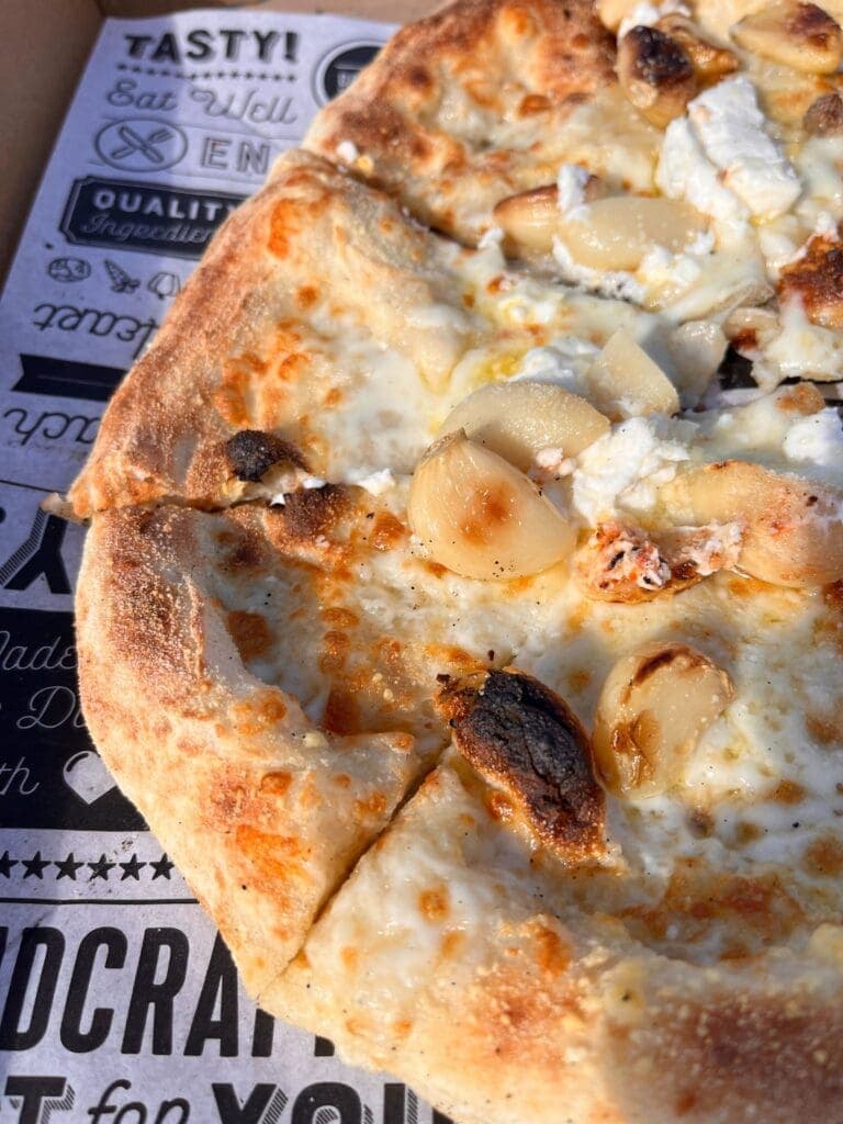 a close up of a slice of pizza