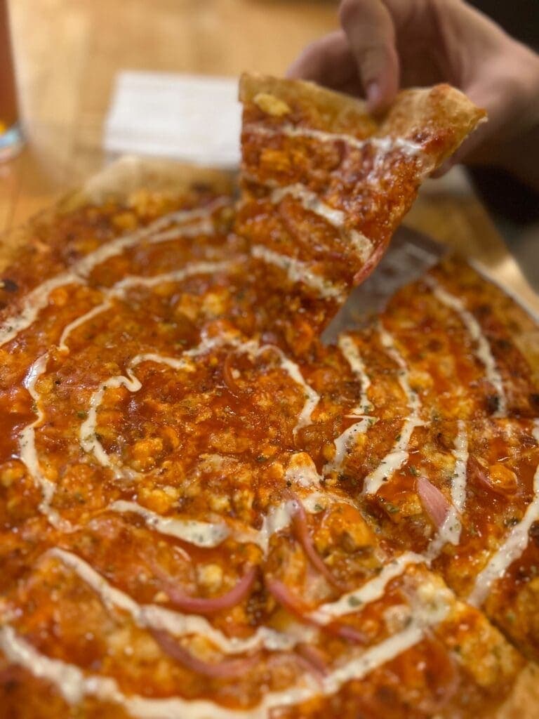 a close up of a slice of pizza