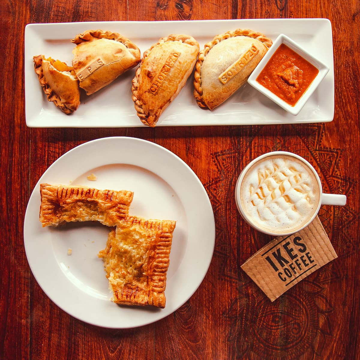 Empanadas, a pasty, and a latte from Ike's Coffee at Bombolé Eatery (Credit: Jackie Tran)