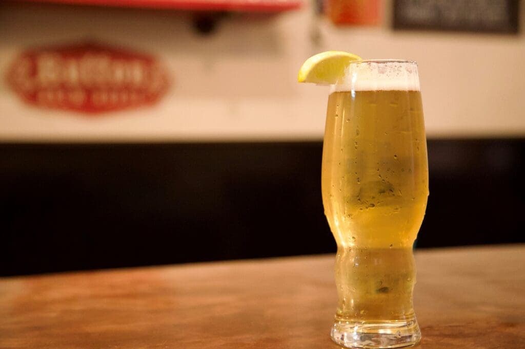 a glass of beer on a table
