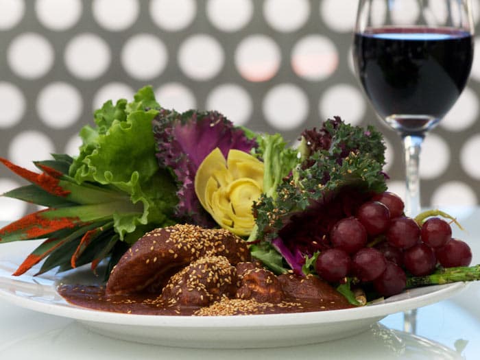 Chicken mole on the patio at Cafe Poca Cosa (Credit: Cafe Poca Cosa)