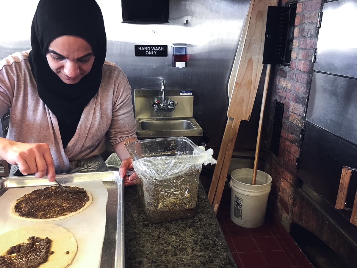 Yasmin preparing Manoushe Zaatar at Caravan Grill (Credit: Meredith O'Neil)