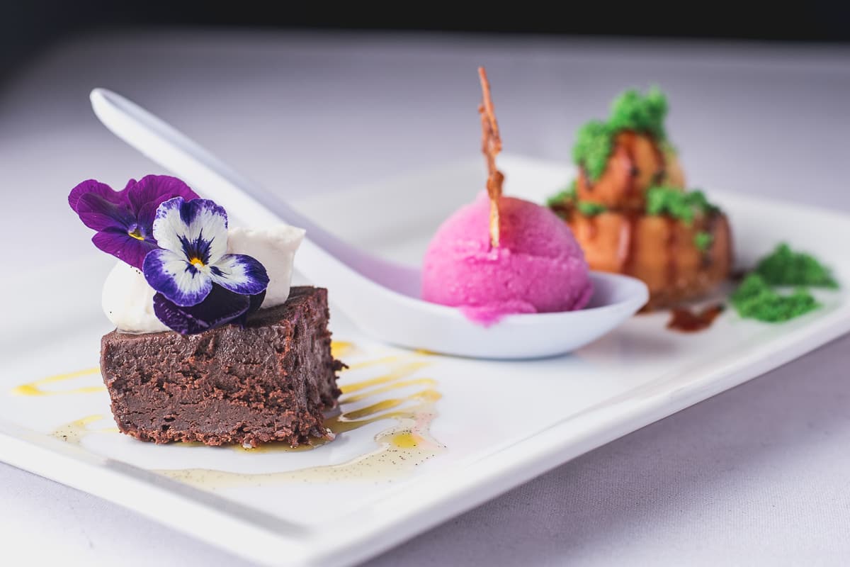 Chocolate Ganache Cake, Prickly Pear Limoncello Granita, and Donut at a Gastronomic Union of Tucson (GUT) dinner at the Carriage House (Credit: Jackie Tran)