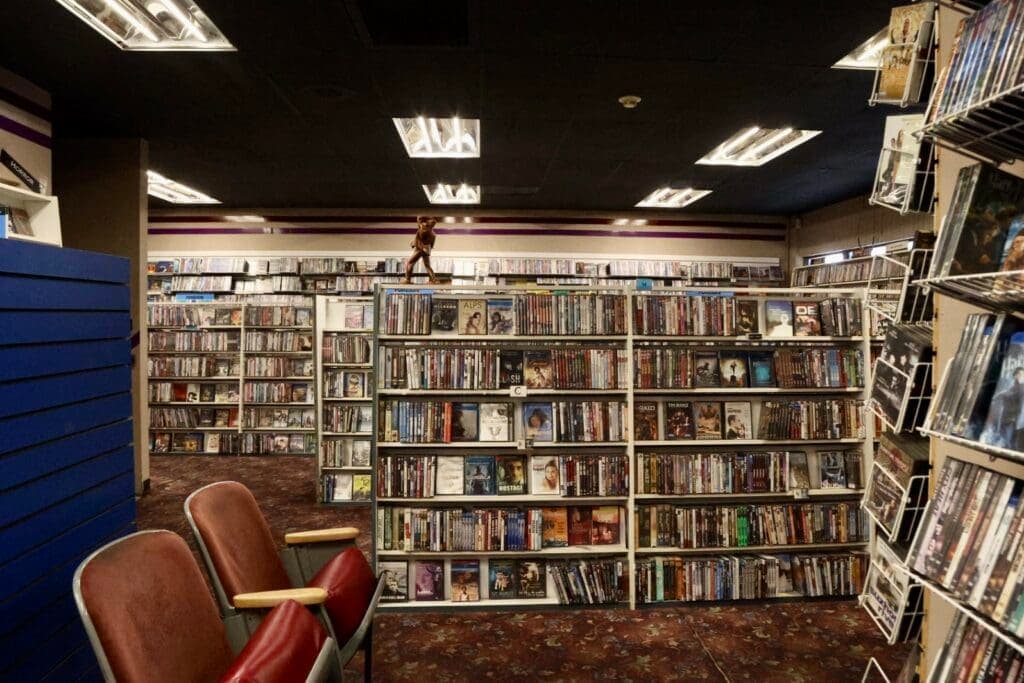 a room with a book shelf filled with books