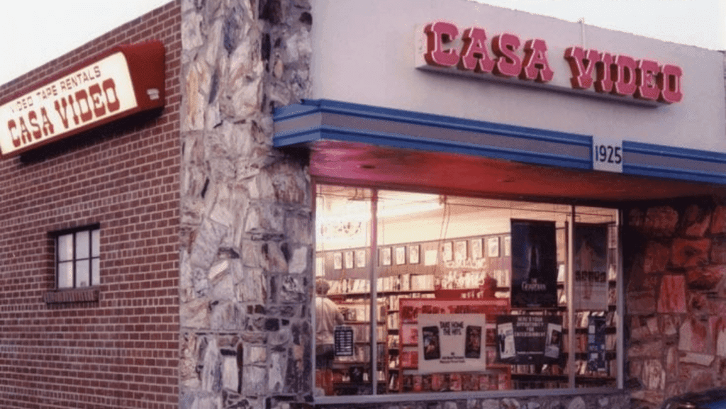 a sign above a store in a brick building