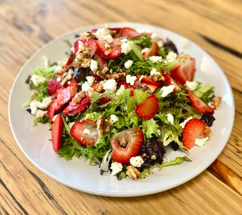 Strawberry, Goat Cheese, & Toasted Walnut Salad with Lemon Balsamic Dressing (Photo courtesy of Ghini's French Caffe)