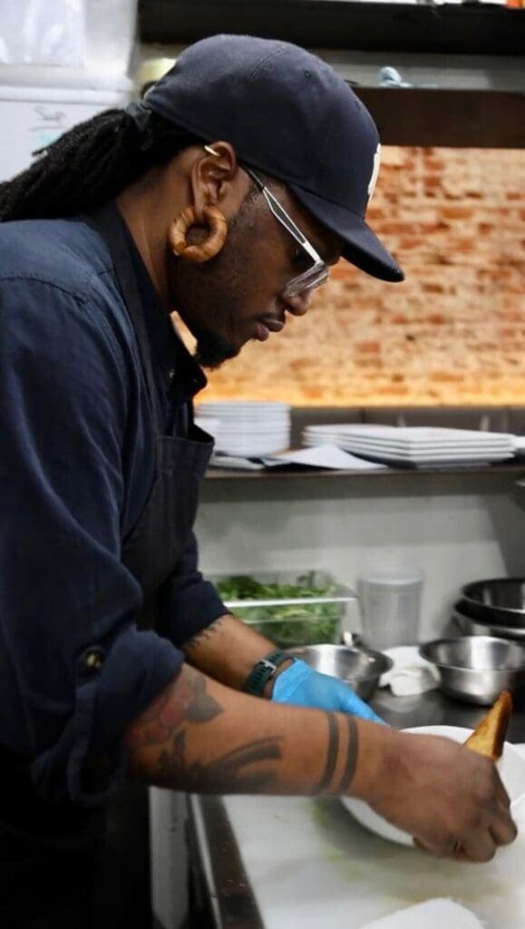 a man preparing food in a kitchen