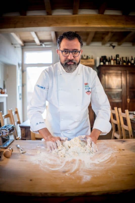 a man preparing food in a kitchen