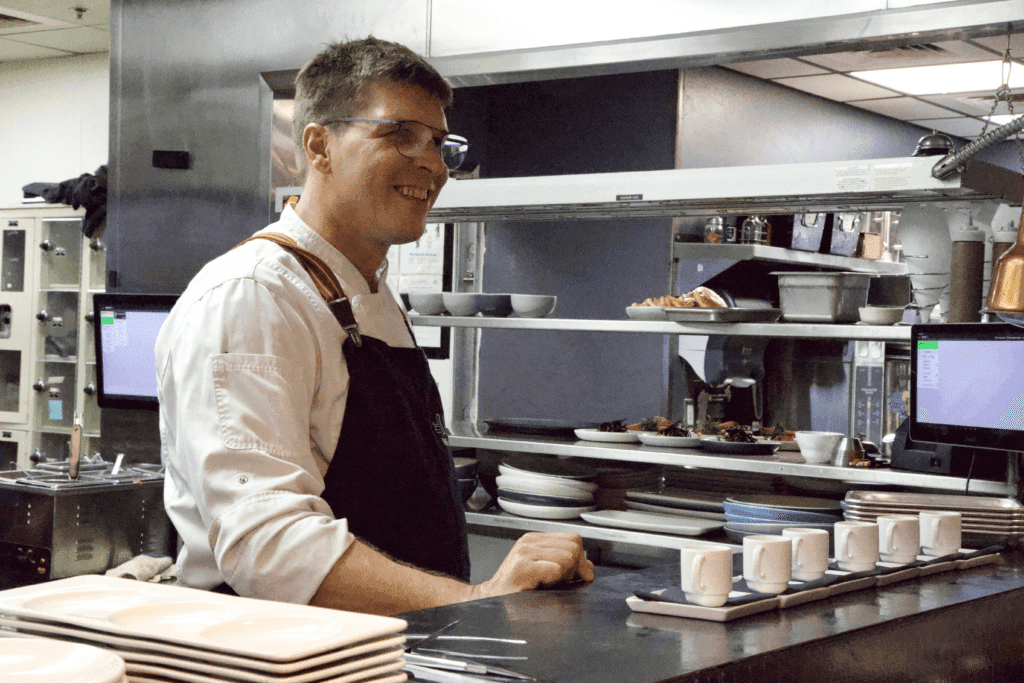 a man preparing food in a kitchen