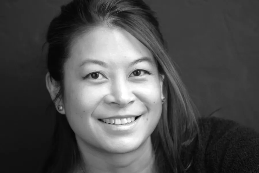 a woman who is smiling and looking at the camera