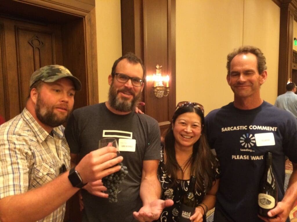 a group of people holding wine glasses