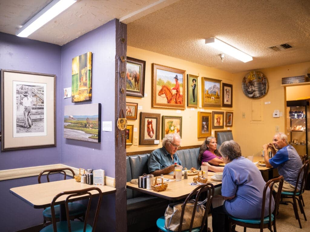 a group of people sitting at a table in a room