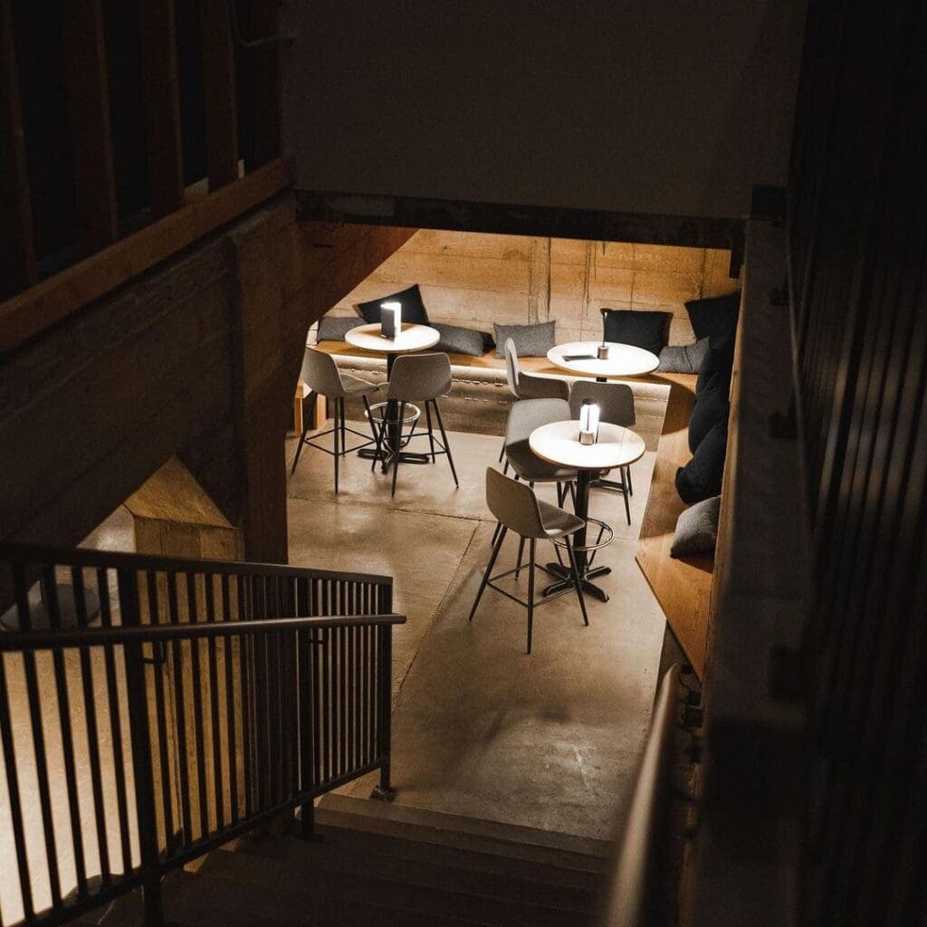 a kitchen with a table and chairs in a room