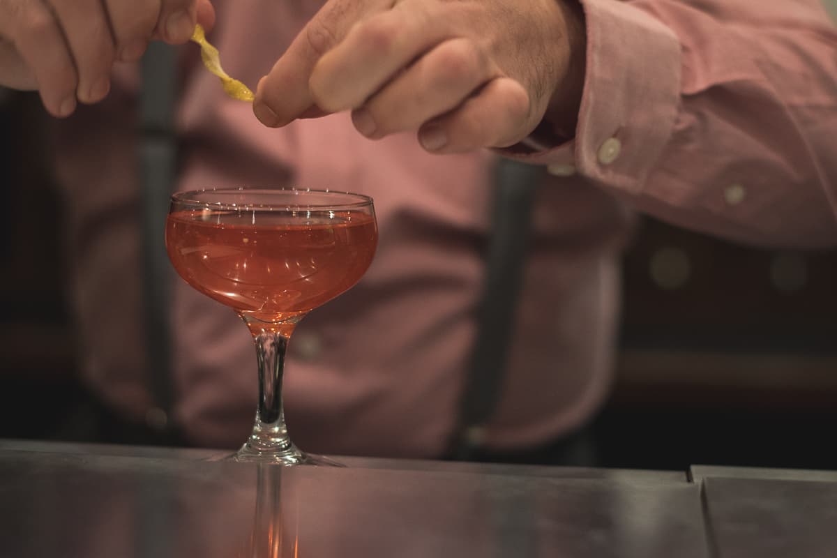 Bartender Adam Fisher prepares a cocktail at the Traveller Bar (Credit: Jackie Tran)