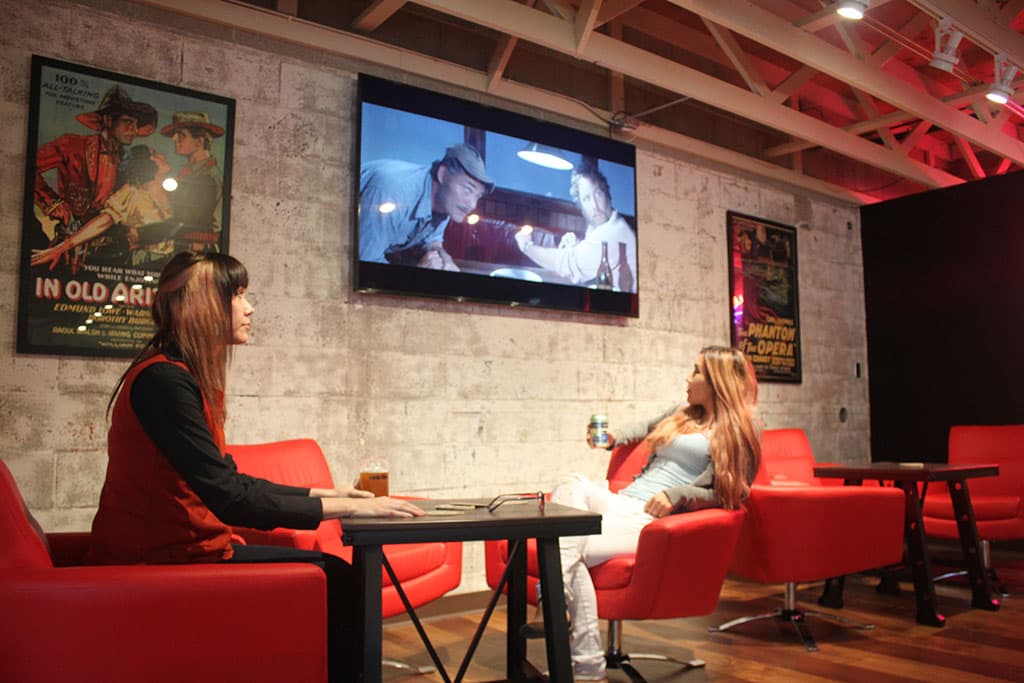 Two of the five 55-inch flat screen televisions will display the daily draft list, while three others will play movies. (Credit: Ty Young)