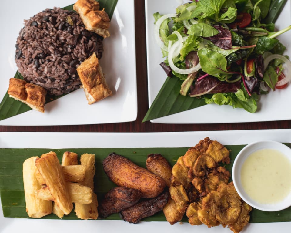 Congri Cubano y Chicharron, Maritza Mojito Cuban Salad, fried yucca, maduros, tostones, and mojo aji at Cuban Blaze (Credit: Jackie Tran)