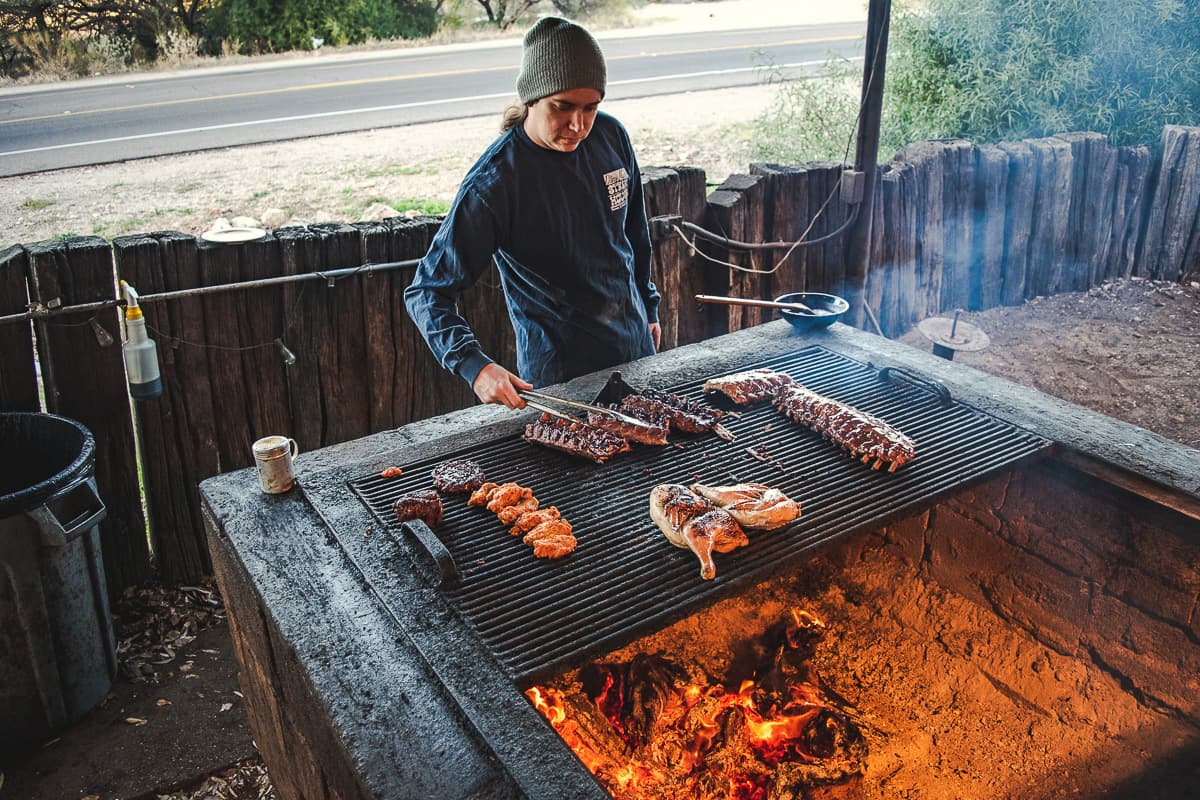 Partner and grill master Jake Root grilling at Daisy Mae's Steak House (Credit: Jackie Tran)