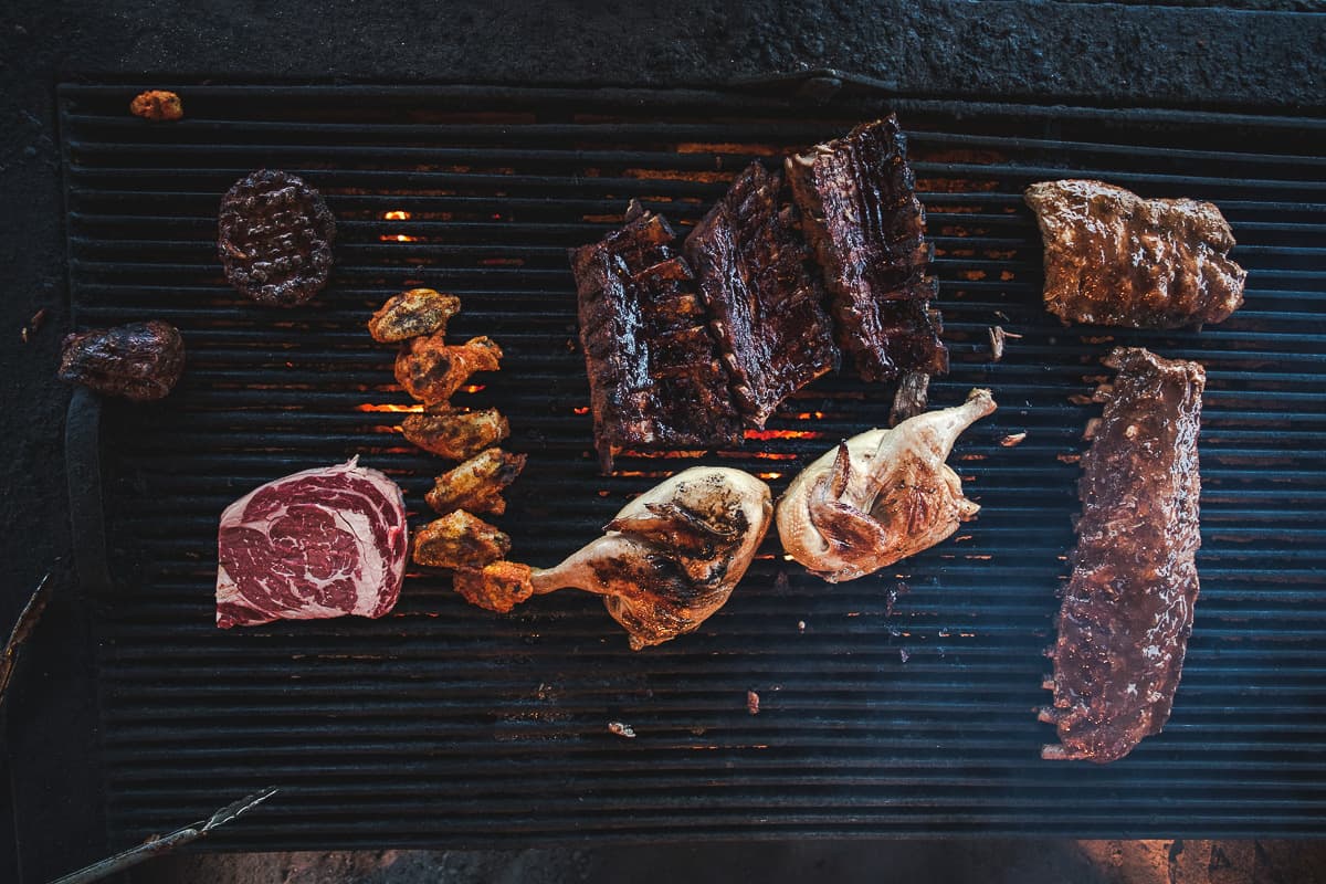 Filet mignon, rib eye steak, wings, chicken, and ribs on the grill at Daisy Mae's Steak House (Credit: Jackie Tran)