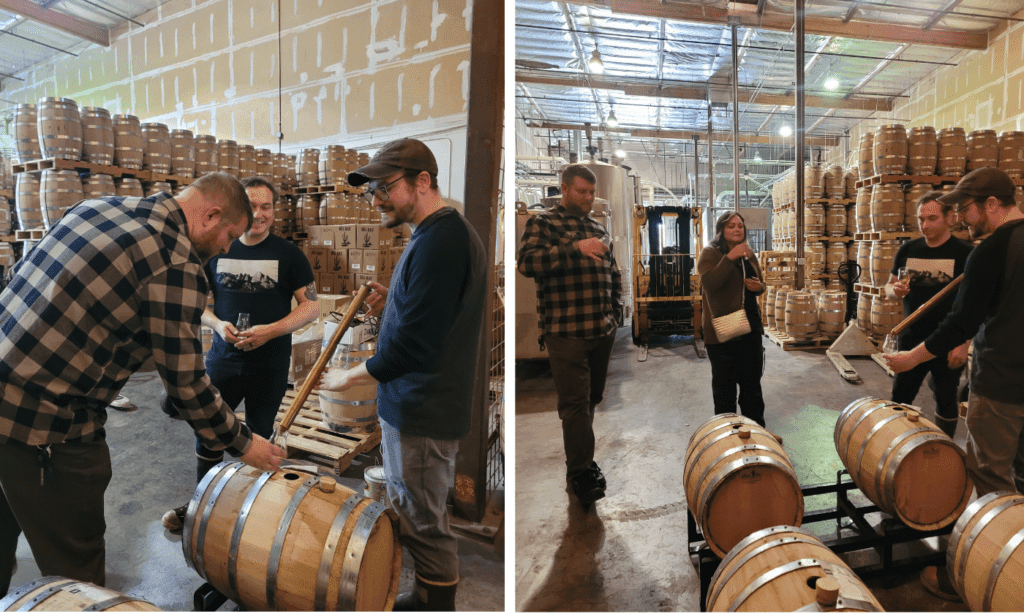 a group of people standing in front of a barrel