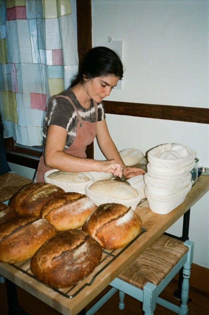 a person sitting at a table with food