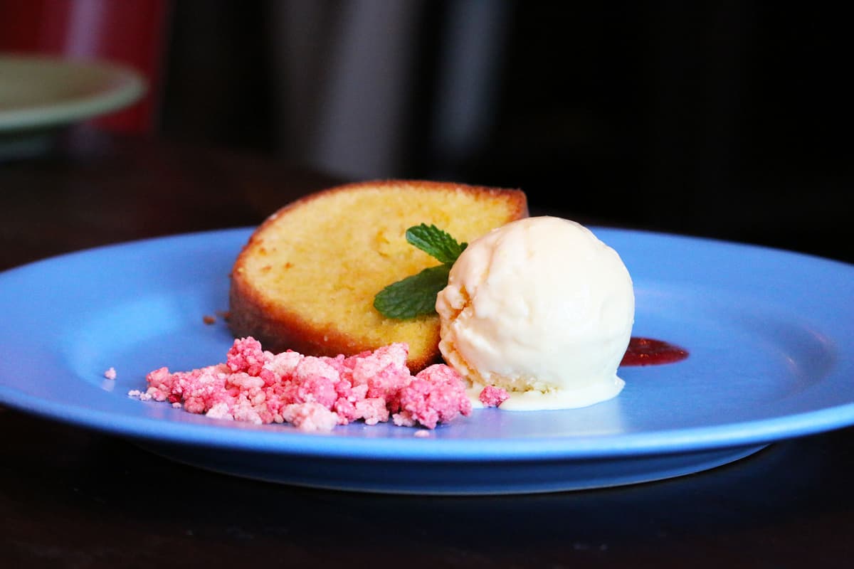 Citrus Almond Cake with Passion Fruit Ice Cream, Blackberry Sauce, and Strawberry White Chocolate Crumble
