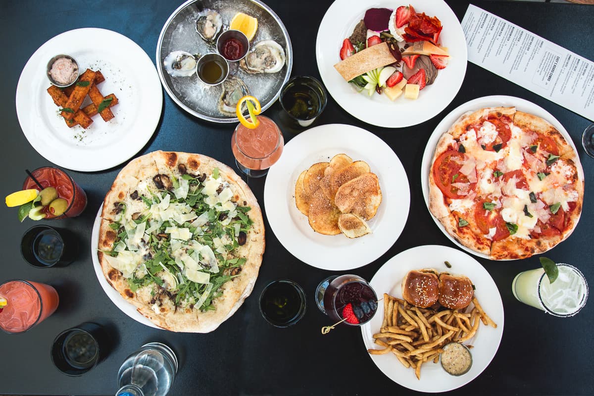Spread of happy hour items at Maynards Market