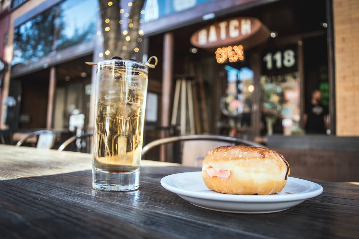 We Fly High cocktail and Creme Brulee doughnut at Batch Cafe & Bar (Credit: Jackie Tran)