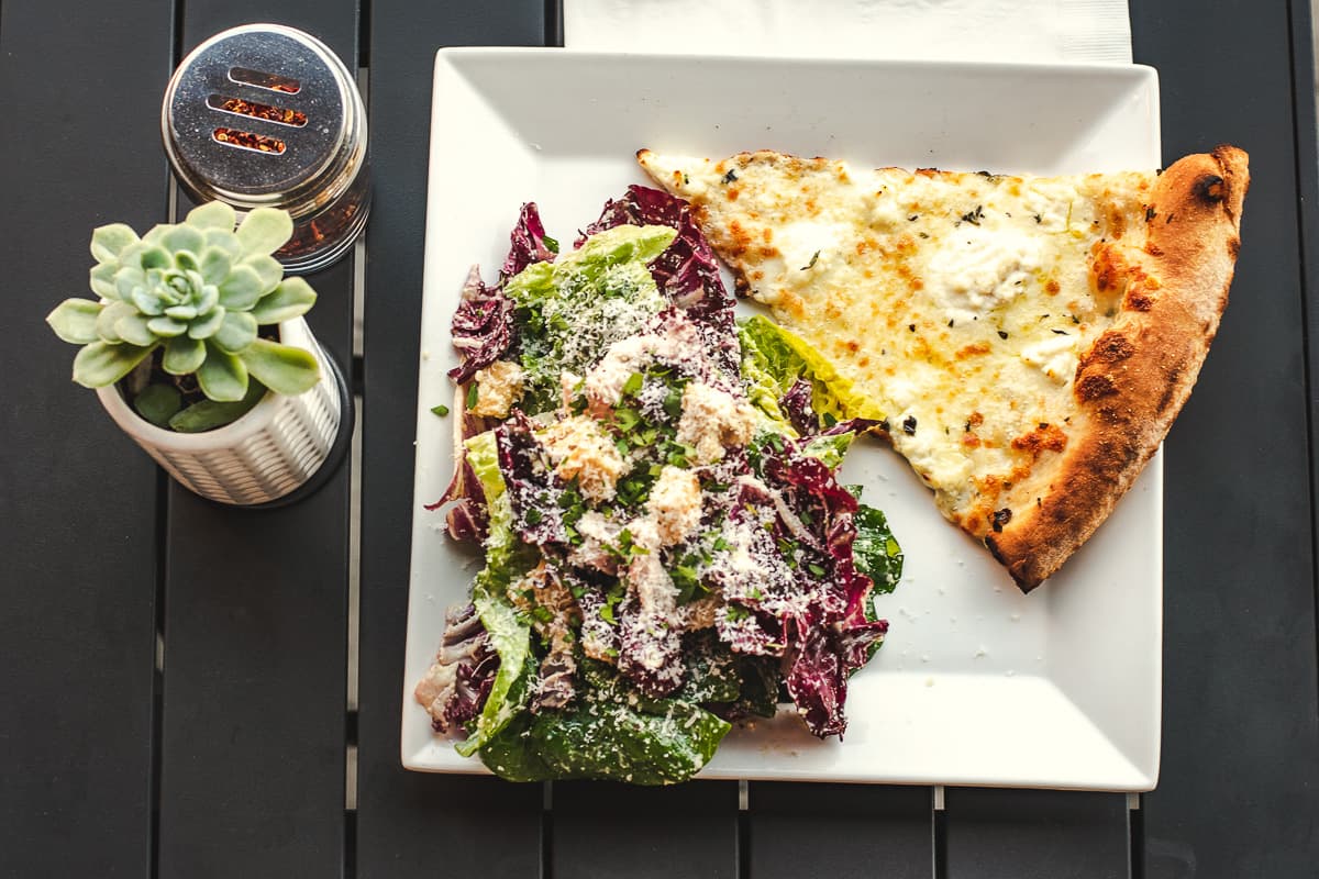 Radicchio Caesar Salad and Bianca slice at Pizza Luna (Credit: Jackie Tran)