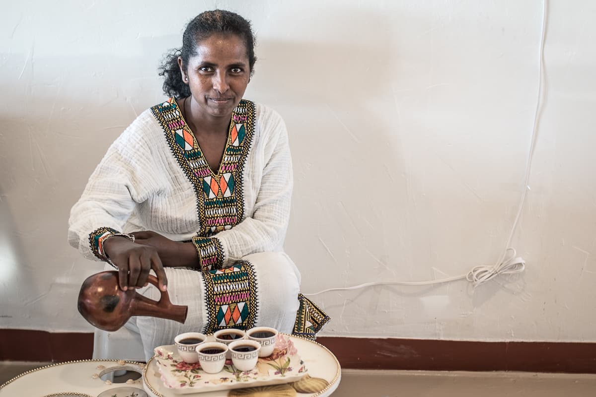 Negesti Gebremichael pouring coffee at Queen Sheba (Credit: Jackie Tran)