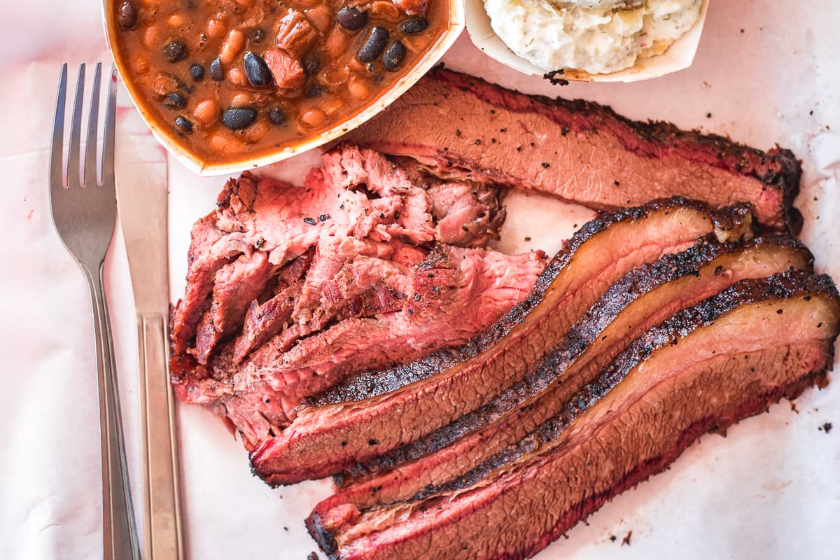 Brisket, tri-tip, beans, and potato salad at Holy Smokin' Butts BBQ (Credit: Jackie Tran)