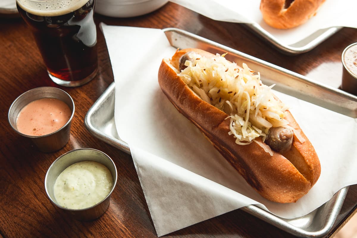 Bratwurst with Sauerkraut at Ten55 Brewing and Sausage House (Credit: Jackie Tran)