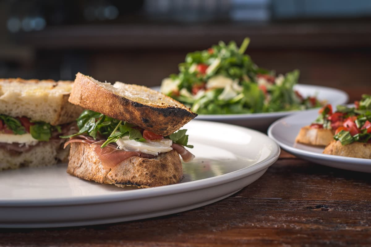 Prosciutto and Arugula Panino, Bruschetta, and Insalata Arugula from Fiamme Pizza Napoletana (Credit: Jackie Tran)