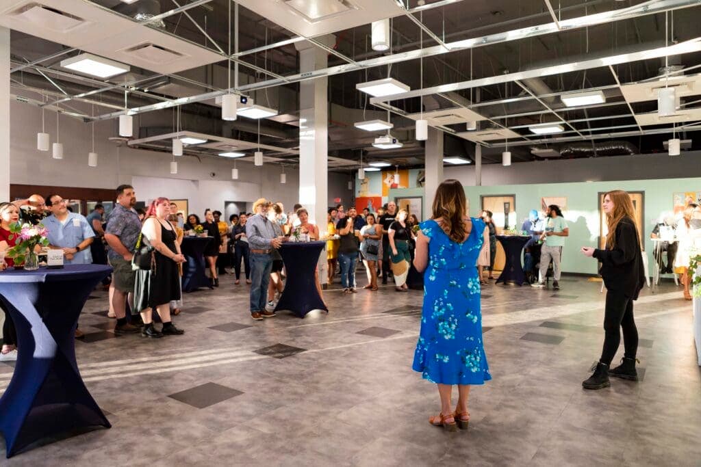 a group of people standing in a room